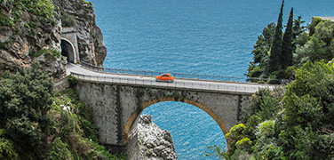 Car driving across bridge Car driving across bridge